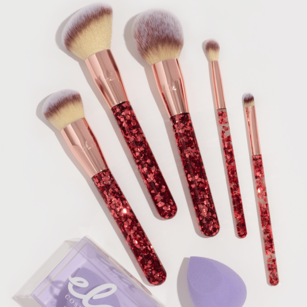 sparkling makeup brush set and purple beauty sponge