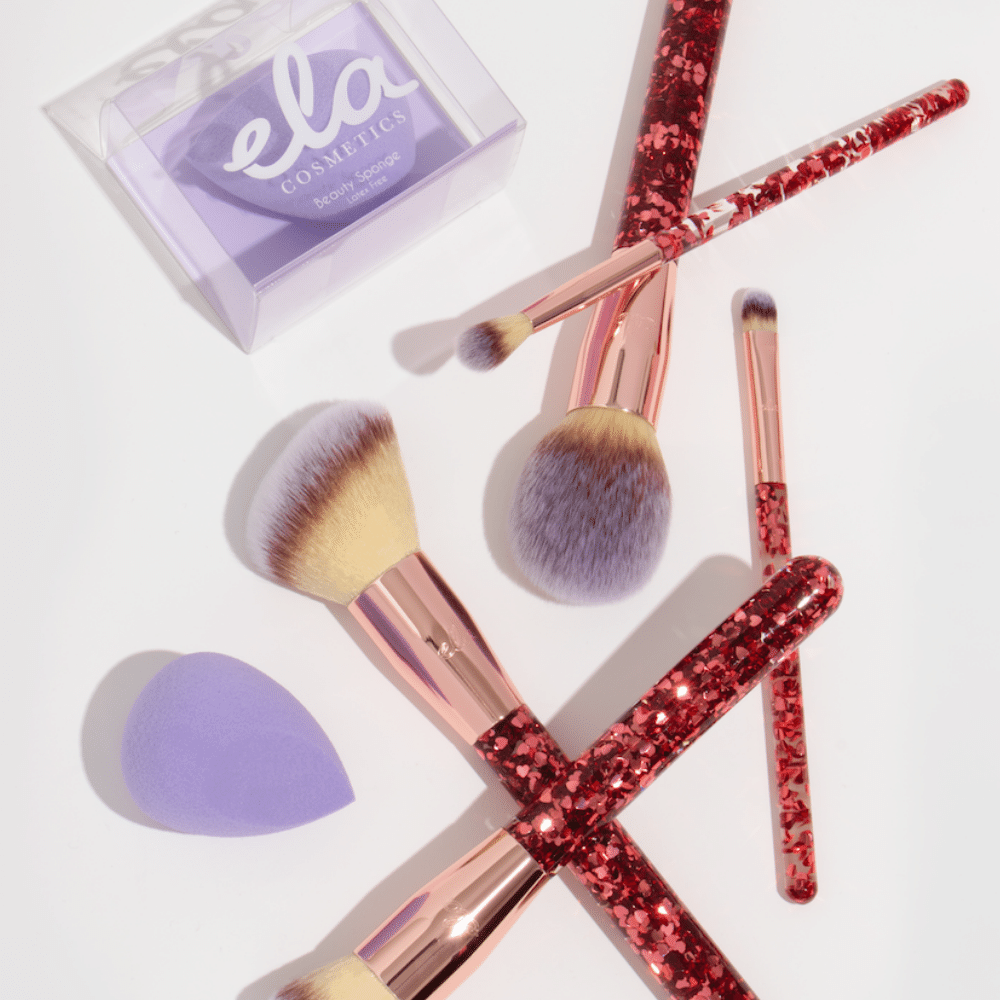 sparkling makeup brush set and purple beauty sponge